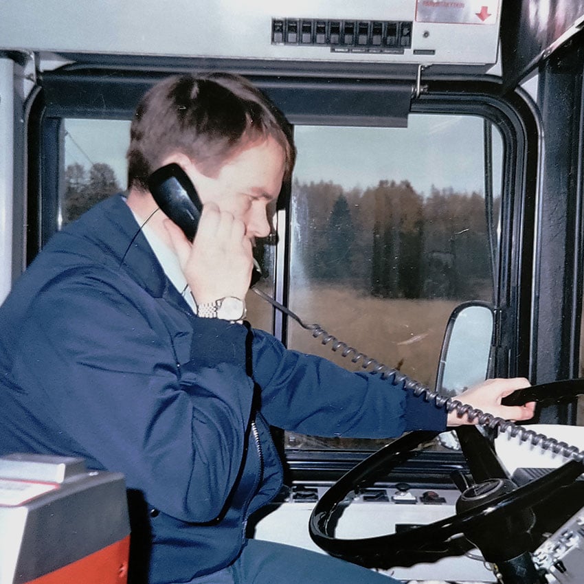 A man driving a bus.