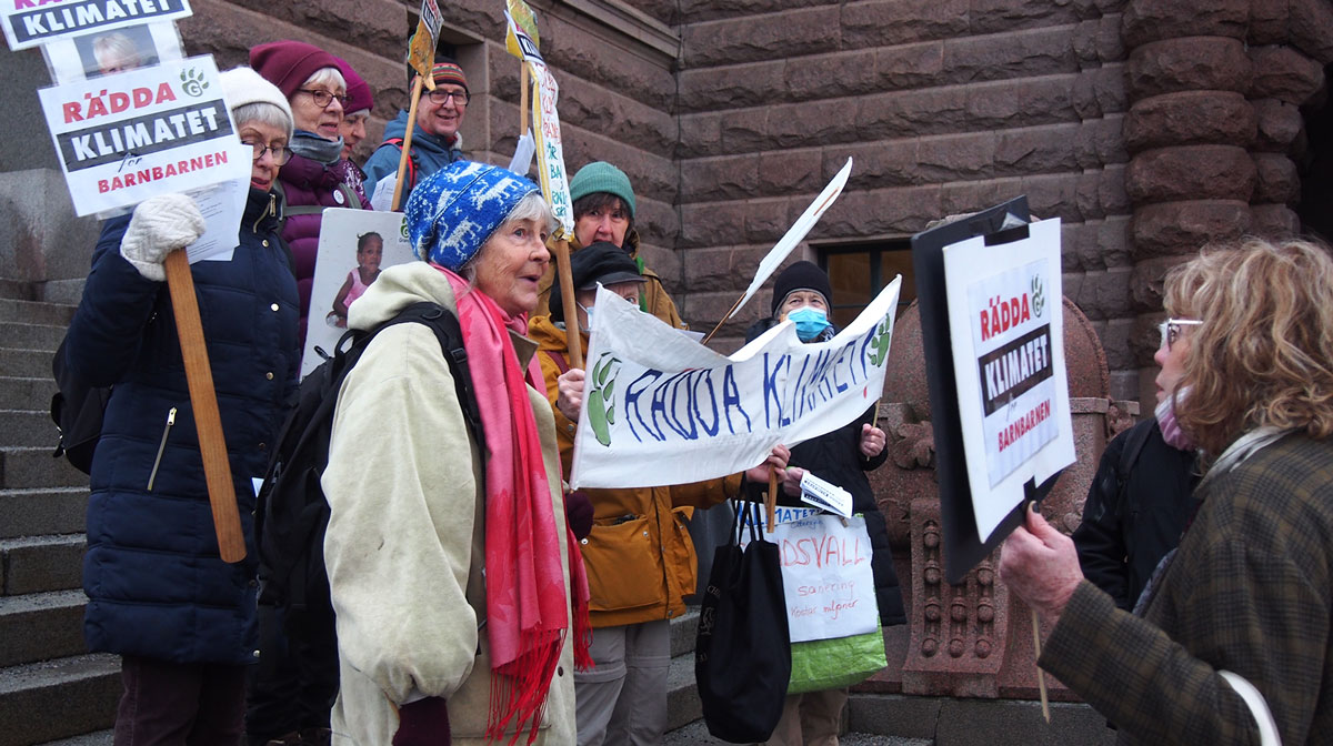 A group of people protesting outside.